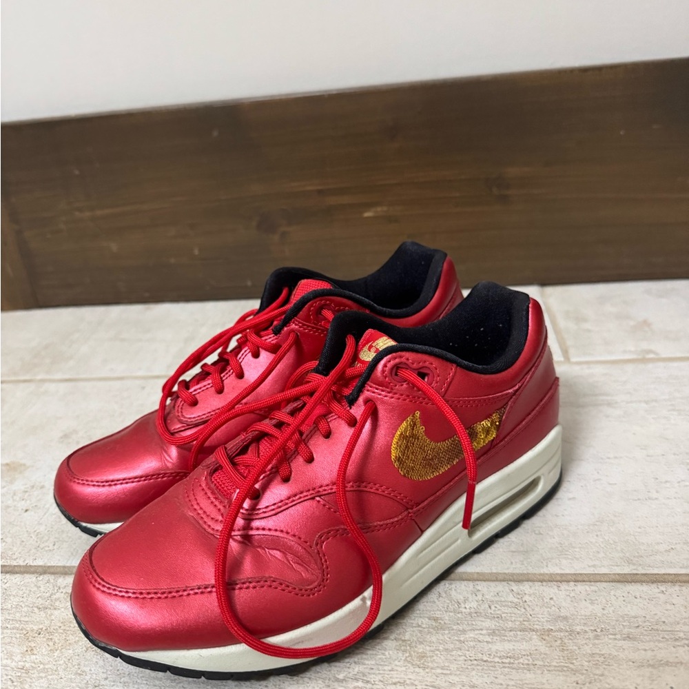 Red and Gold Nike Air Maxes